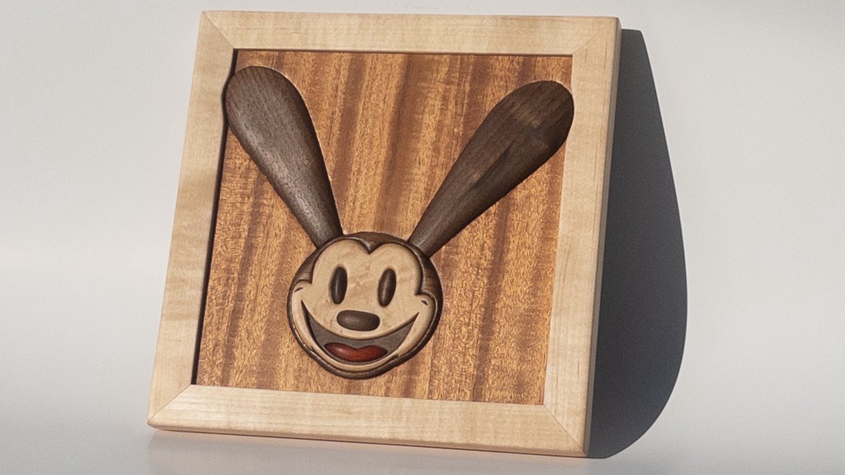 Hand-carved classic cartoon rabbit portrait in figured maple, sapele, and walnut
